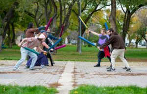 A Group Of People Playing A Game Of Baseball